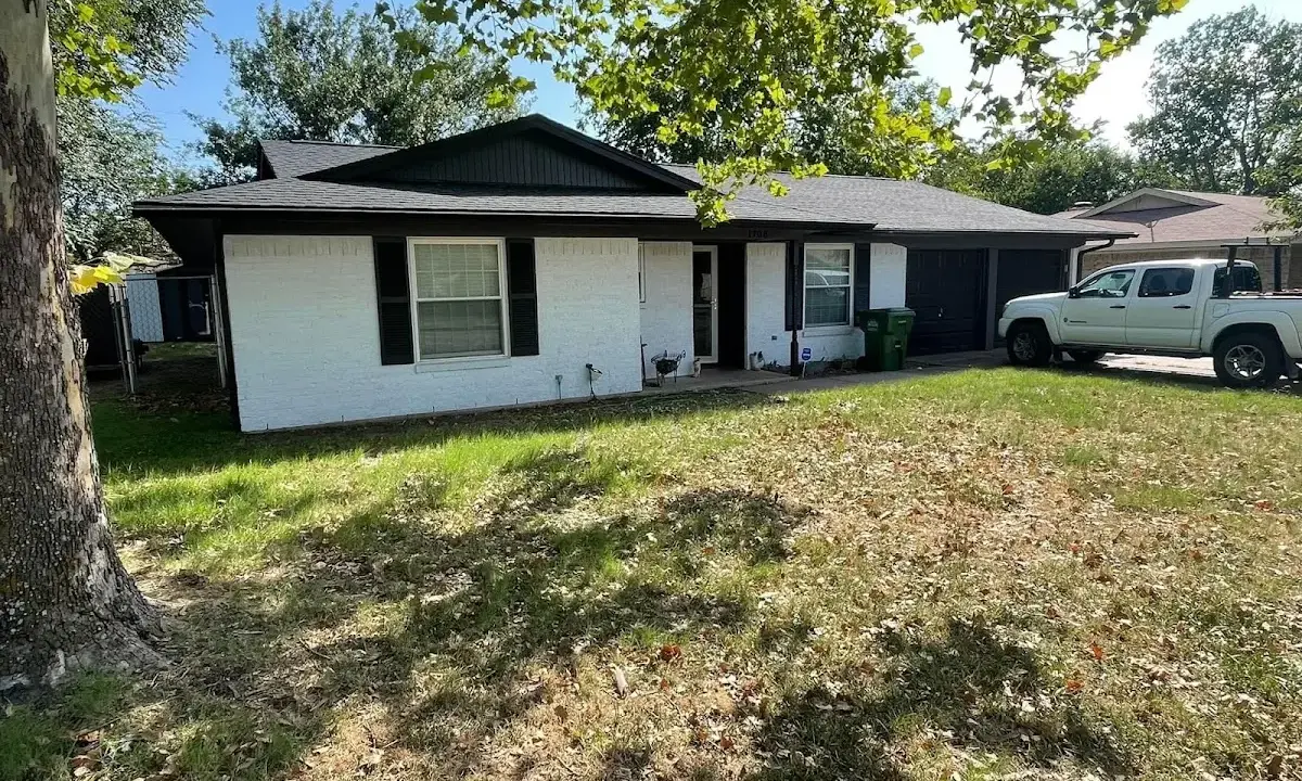 Professional roofing crew working on a residential roof in Pingree Grove